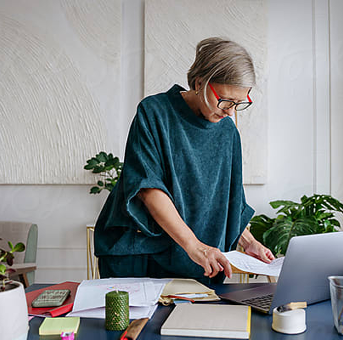 Woman Working on paperwork at computer