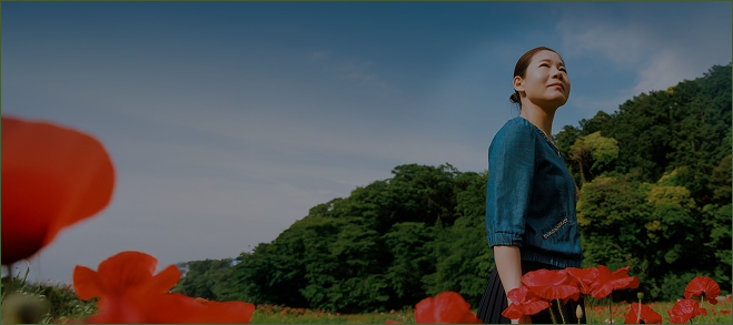public://2025-10/Woman in a field with flowers.png