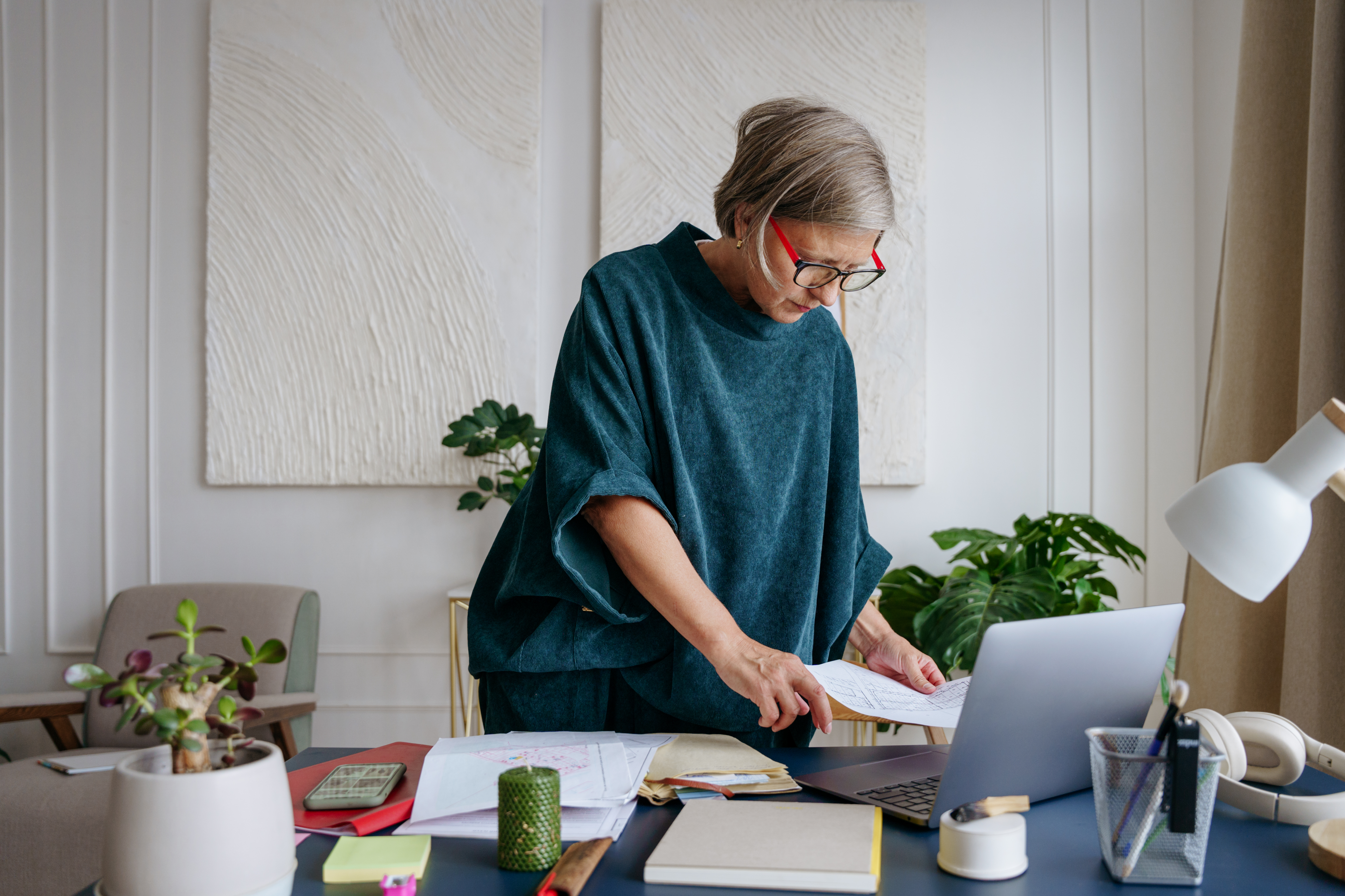 Woman working with papers at her desk